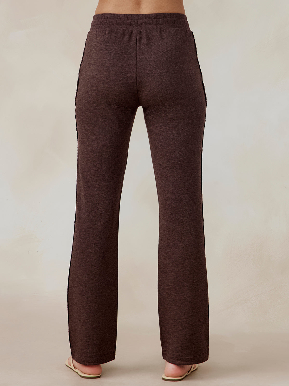 Brown wide leg sweatpants in French terry fabric shown from the back, worn by a model with an elastic waistband tasc Performance Stadium French Terry Wide Leg Pant (MochaHeather)
