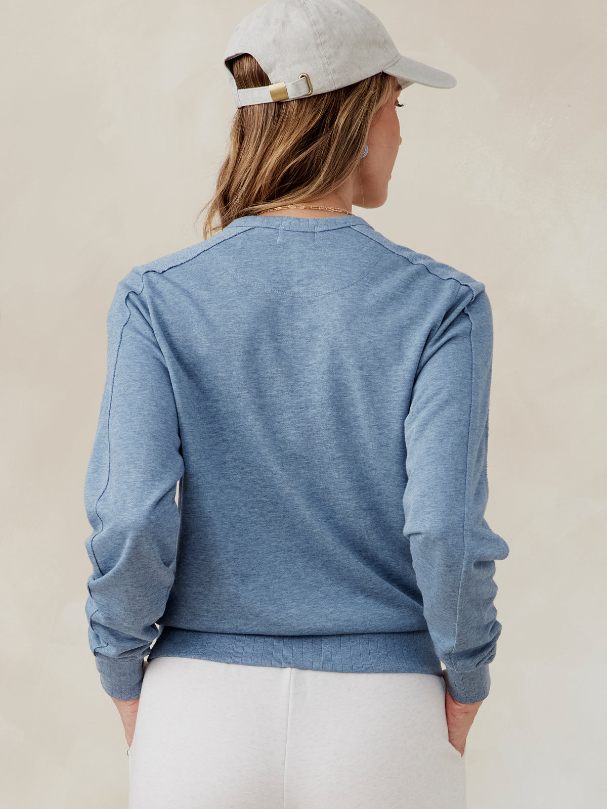 Blue French terry sweatshirt with raglan sleeves, ribbed cuffs, and hem, shown from the back worn by a model tasc Stadium Sweatshirt (AnchorHeather)