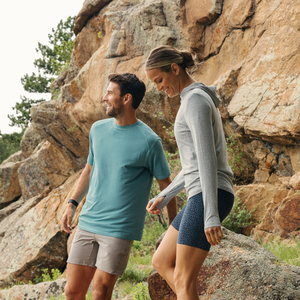 a couple hiking in tasc activewear